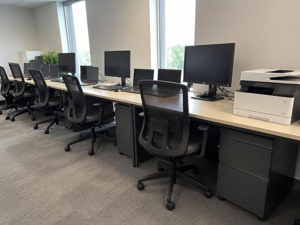 Example photo of an office with monitors, chairs and a printer documented in MemoSafe